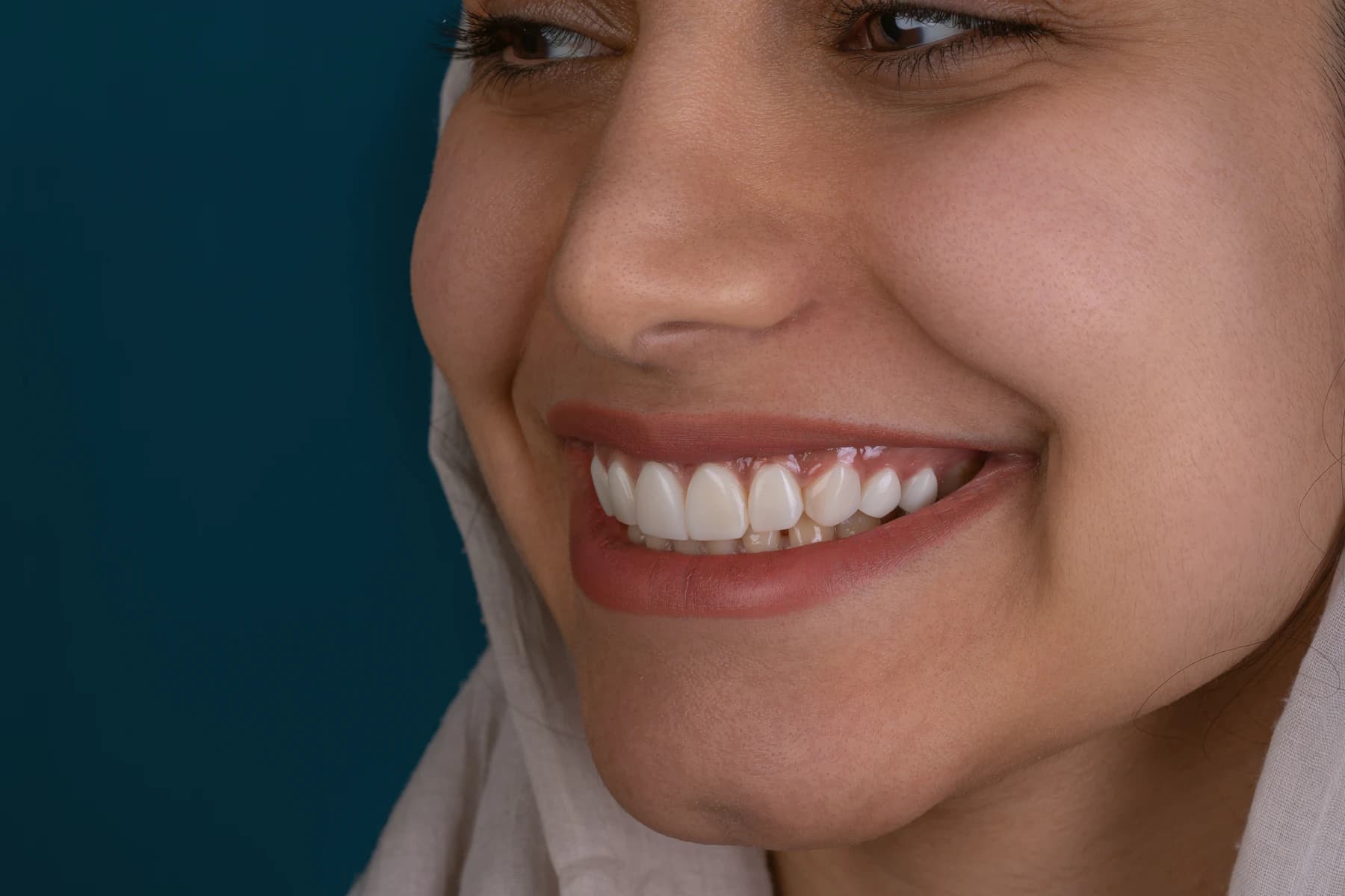 A smiling patient in soft natural light