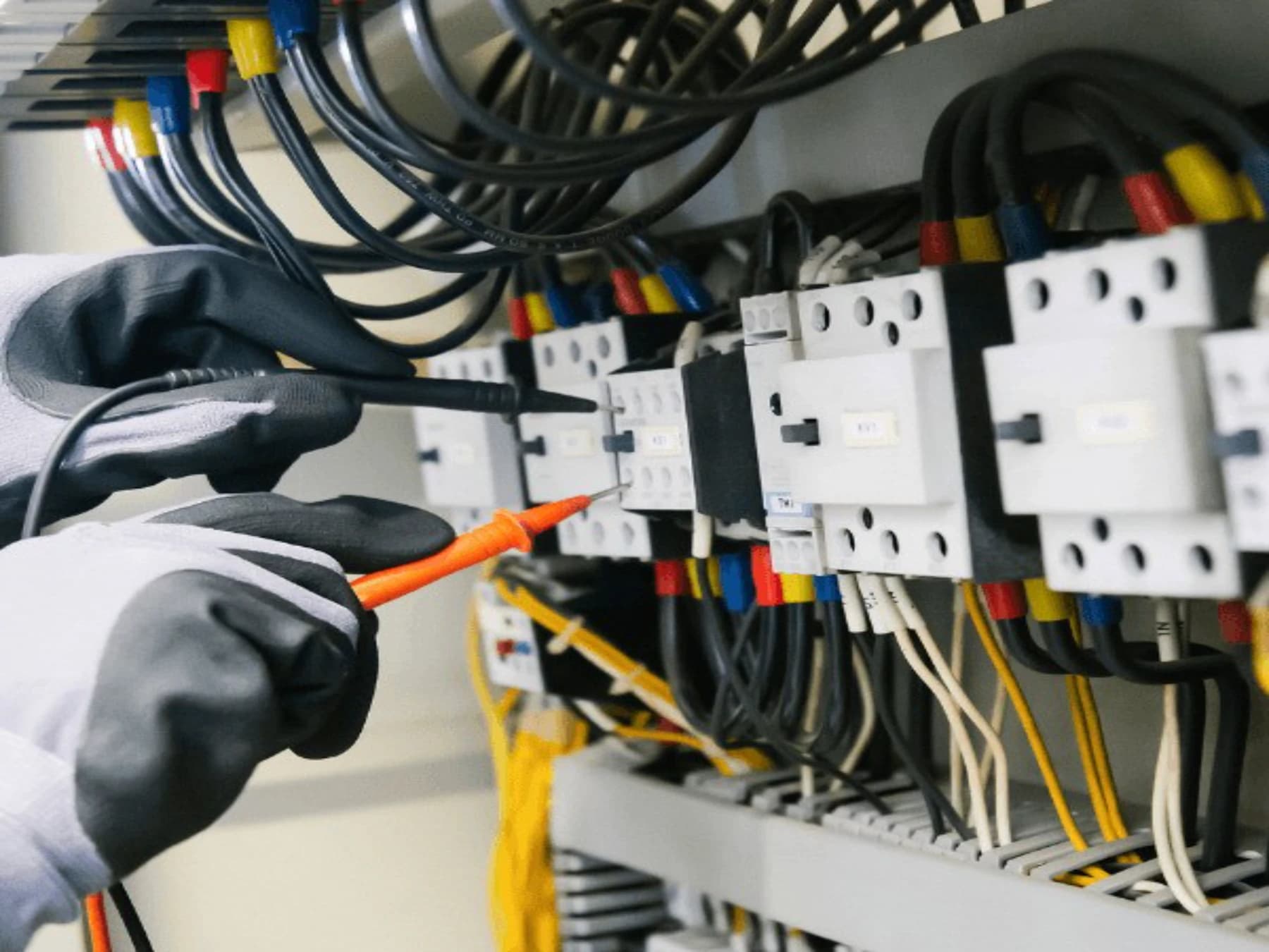 Electrician testing a detailed electrical panel